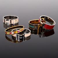 5 Hermes Enamel Bangle Bracelets - Sold for $2,750 on 04-23-2022 (Lot 256).jpg